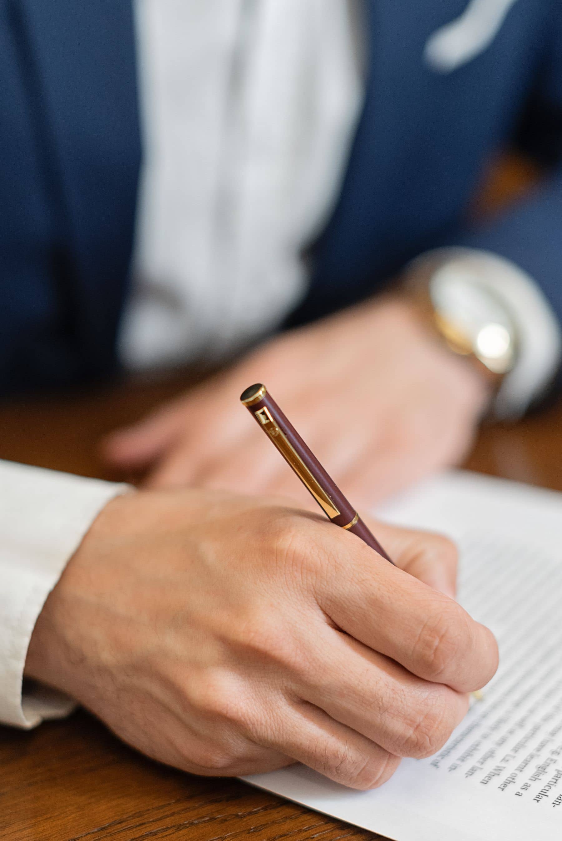 Signing a document at a desk